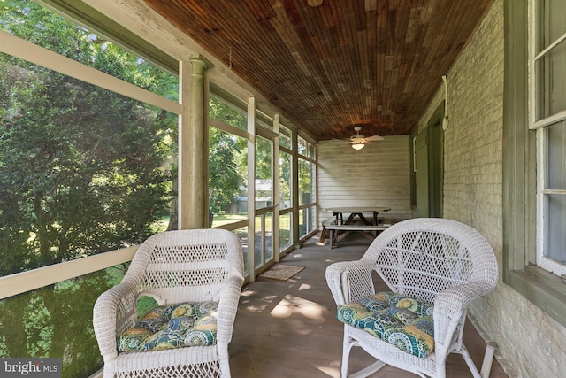 sunroom featuring wooden ceiling