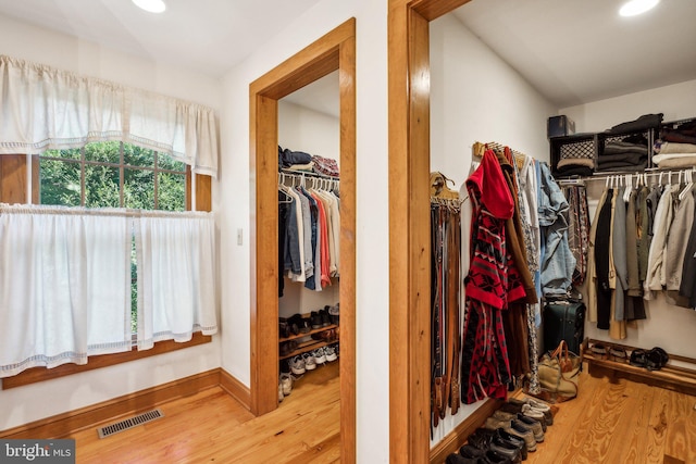 walk in closet featuring wood-type flooring