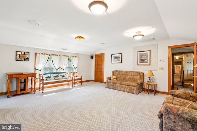 living room with lofted ceiling and carpet