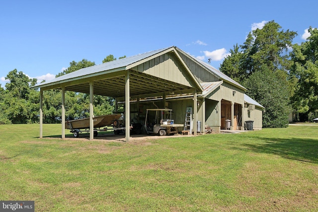 exterior space with an outdoor structure and a yard