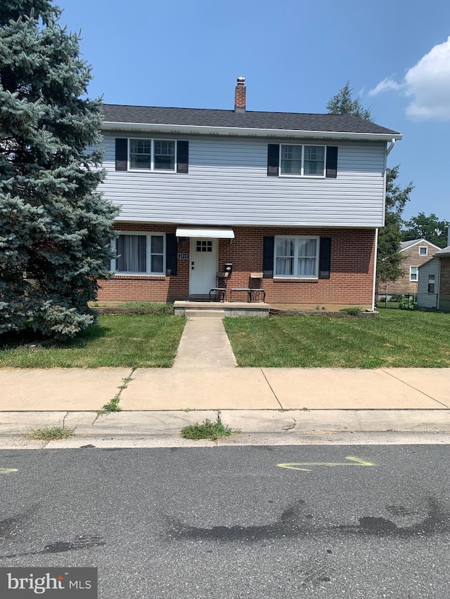 view of front of home with a front lawn