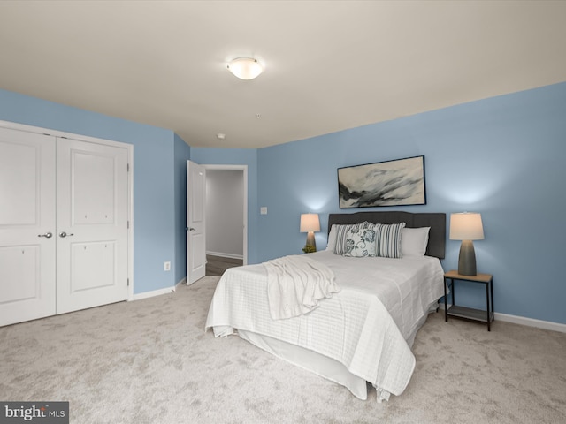 carpeted bedroom featuring a closet