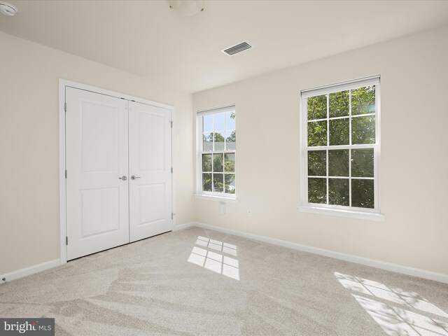 bedroom with light carpet, ceiling fan, and vaulted ceiling