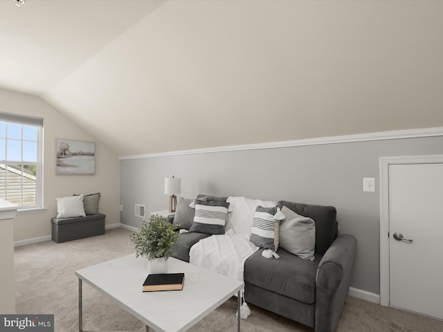 carpeted living room with vaulted ceiling