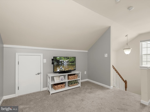 living room featuring vaulted ceiling and carpet flooring