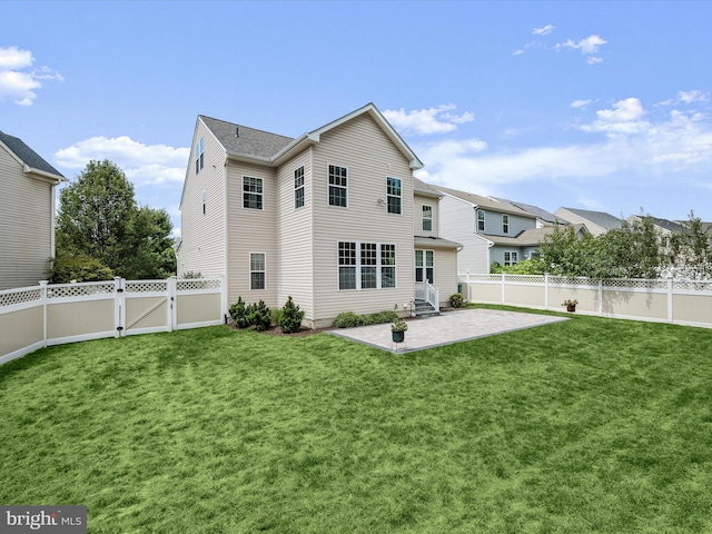 back of property featuring a lawn and a patio area