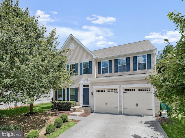 view of front of property with a garage