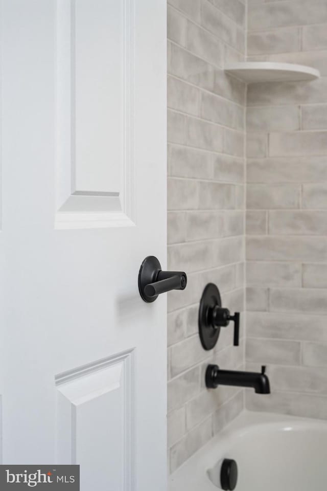 interior details featuring  shower combination