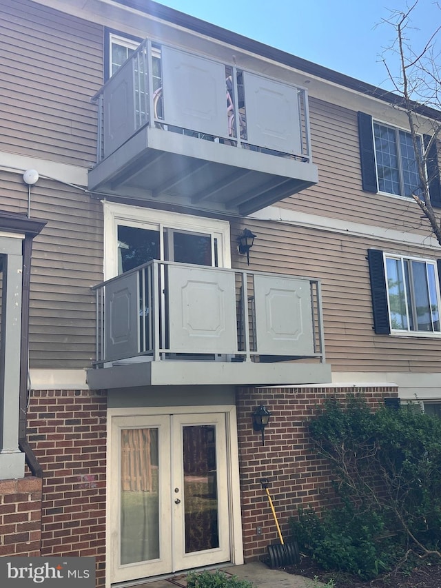 4300 Buckman Rd Unit H, Alexandria, VA 22309 - rear view of property with a balcony, french doors, and brick siding