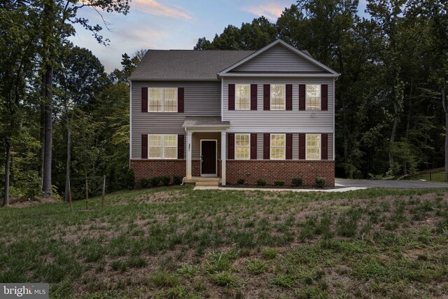 view of front of home with a front yard