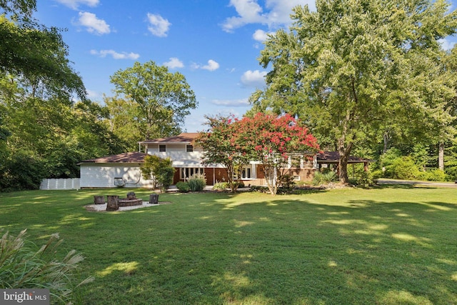 view of yard with an outdoor fire pit