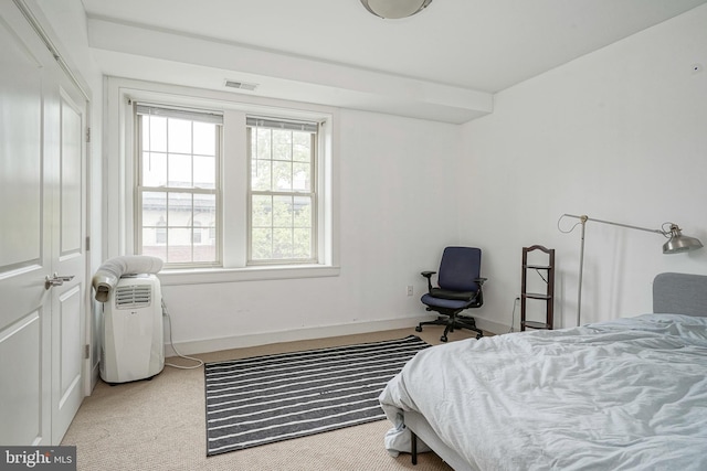 bedroom with light colored carpet