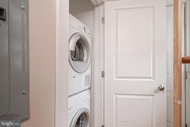 laundry room featuring stacked washer and dryer