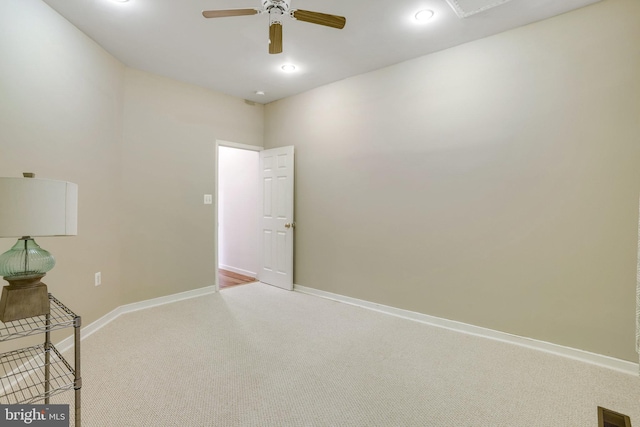 spare room featuring carpet floors and ceiling fan