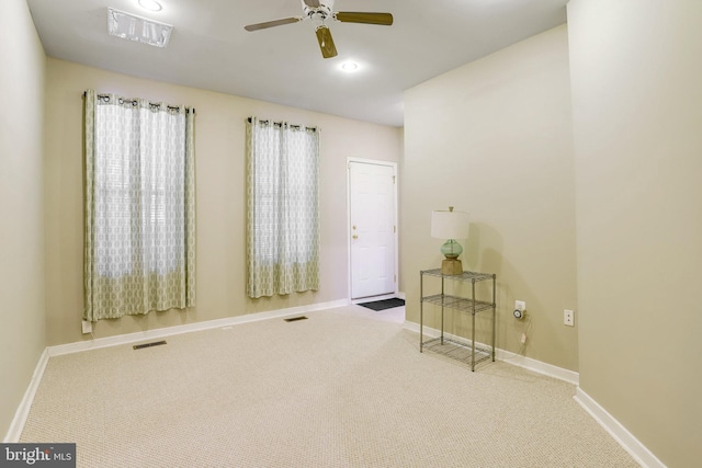 carpeted empty room with ceiling fan