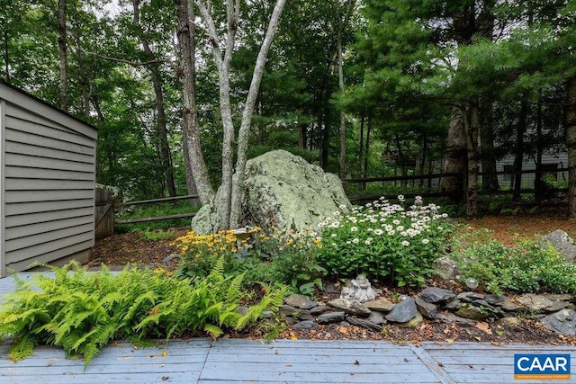 view of yard featuring a wooden deck