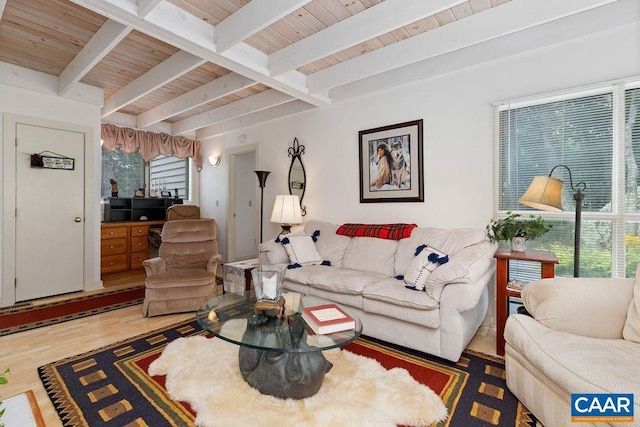 living room featuring hardwood / wood-style floors, beam ceiling, and wooden ceiling