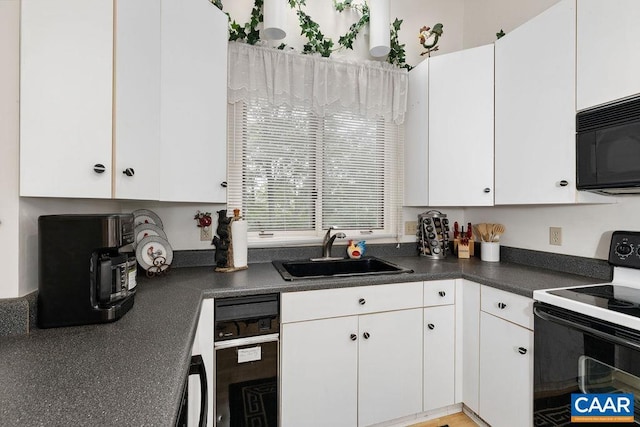 kitchen featuring sink, white cabinets, and black appliances