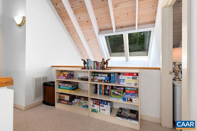 playroom featuring carpet floors, wooden ceiling, and lofted ceiling with beams