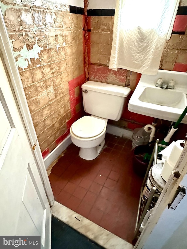 bathroom with sink, tile patterned floors, and toilet