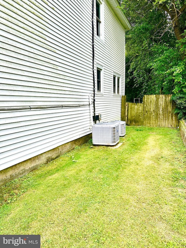 view of yard with central AC unit