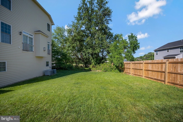 view of yard with central AC unit