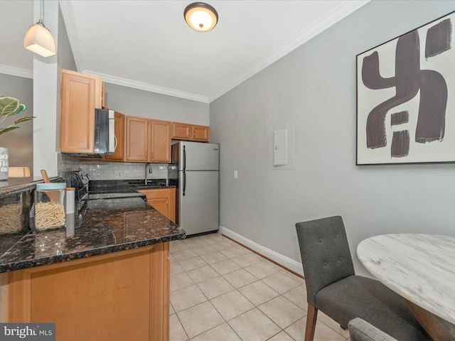 kitchen featuring light tile patterned flooring, backsplash, range with electric stovetop, stainless steel fridge, and decorative light fixtures