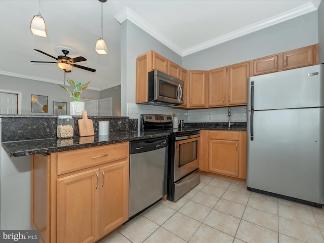 kitchen with dark stone counters, tasteful backsplash, ceiling fan, ornamental molding, and appliances with stainless steel finishes