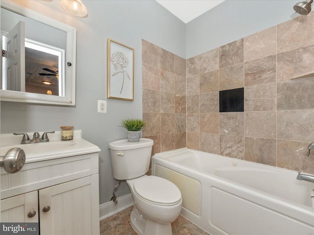 full bathroom featuring tile patterned flooring, toilet, vanity, and tiled shower / bath