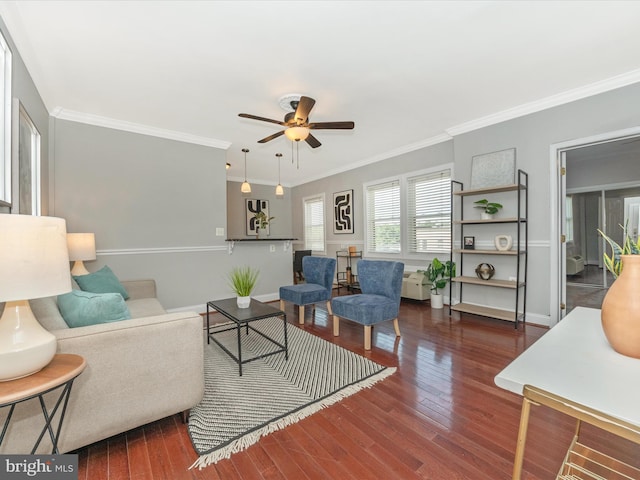 living room featuring crown molding, ceiling fan, and wood-type flooring