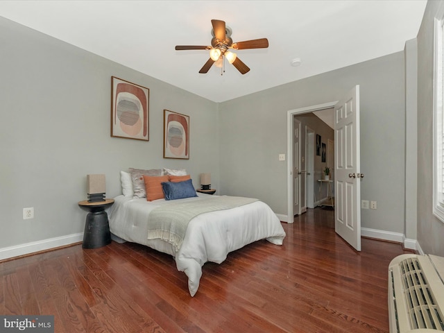 bedroom featuring ceiling fan and wood-type flooring