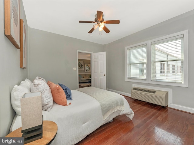 bedroom with dark hardwood / wood-style flooring and ceiling fan