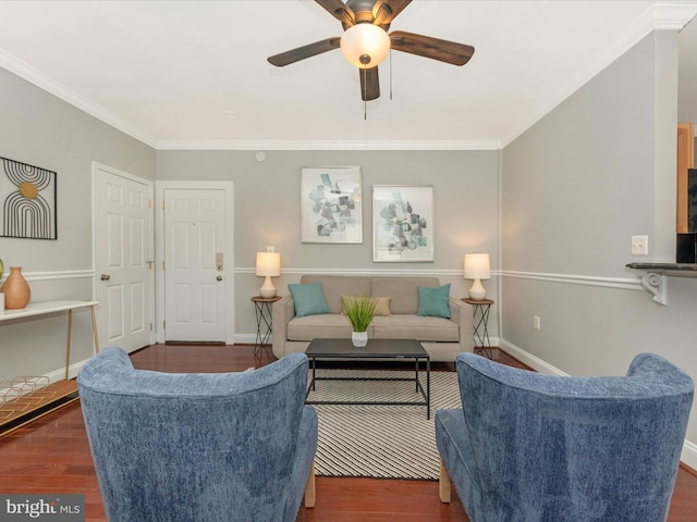 living room featuring dark wood-type flooring, crown molding, and ceiling fan