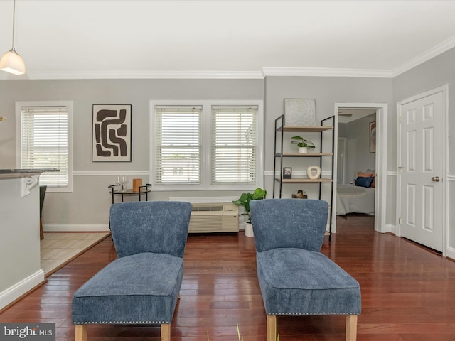 living area featuring dark hardwood / wood-style flooring and crown molding