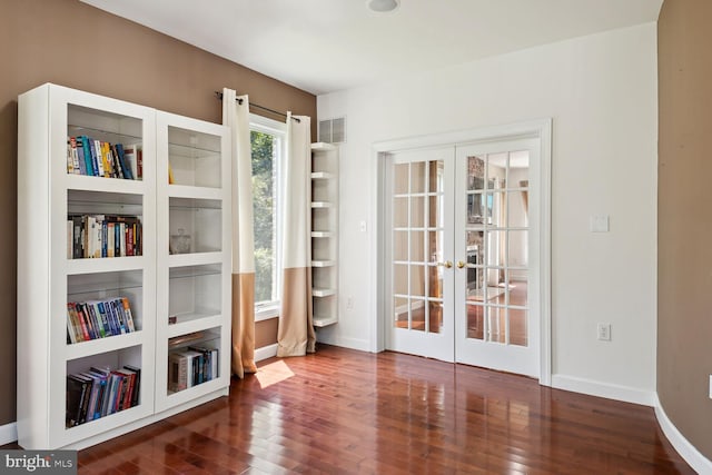 interior space featuring french doors and dark hardwood / wood-style flooring