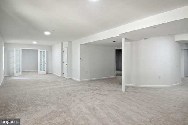 interior space with light carpet and french doors