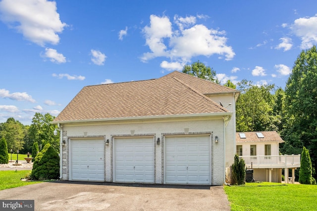 garage with a yard