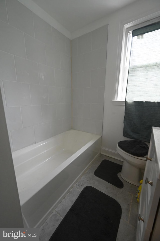 bathroom with tile patterned flooring, vanity, and toilet