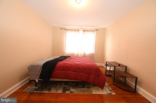 bedroom featuring dark wood-type flooring