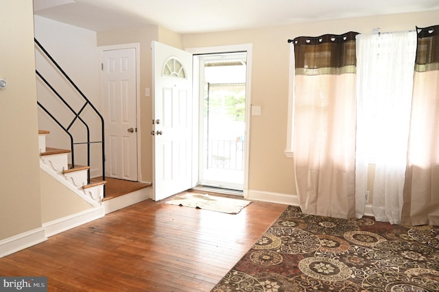 foyer entrance with hardwood / wood-style flooring