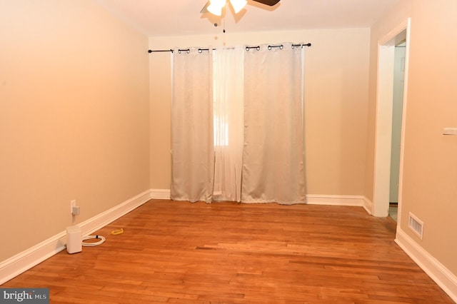 unfurnished room featuring wood-type flooring and ceiling fan