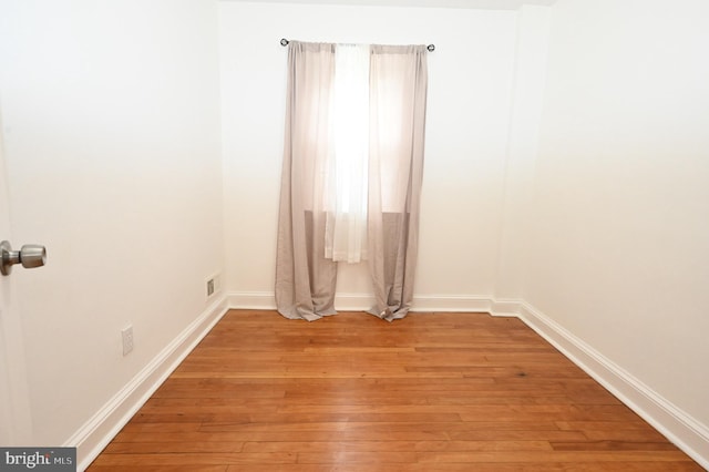 spare room with light hardwood / wood-style floors