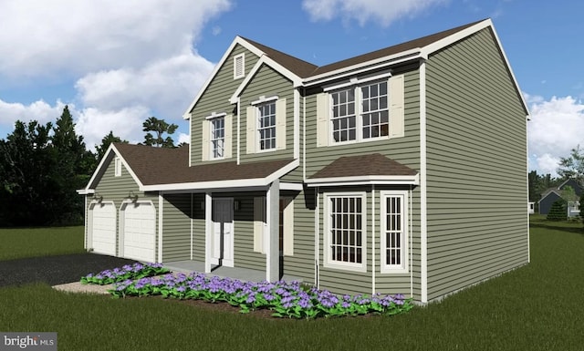 view of front of home featuring a garage and a front lawn