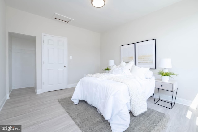 bedroom with light wood-type flooring