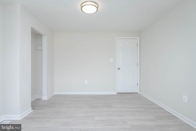 unfurnished room with light hardwood / wood-style floors