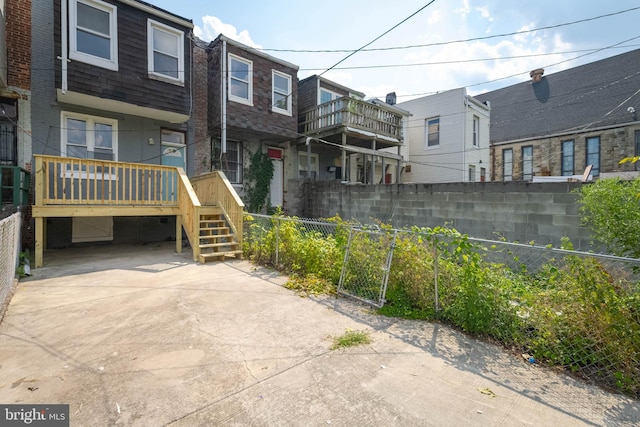 view of front of property featuring a wooden deck