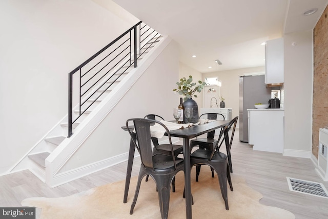 dining area featuring light hardwood / wood-style flooring