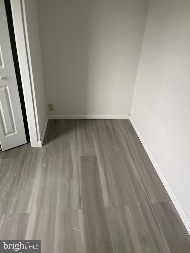 spare room with hardwood / wood-style floors