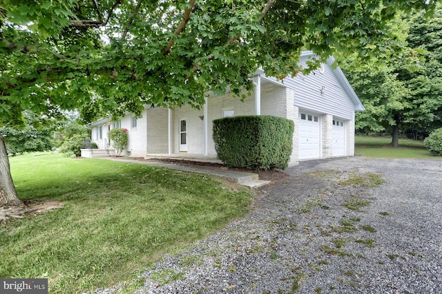 view of front of house with a garage and a front yard