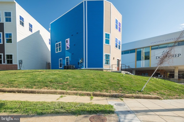 view of building exterior featuring central AC unit